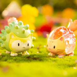 Toy animals on grass from Bomb Cats Blind Box Series.