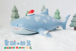 Toy whale shark wearing a Santa hat by Crazy Eyes, limited to 100 pieces worldwide.