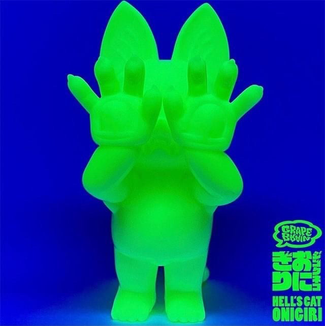 A green animal figure toy with hands covering its eyes, part of ONIGIRI - GID by Grape Brain collection at Strangecat Toys.