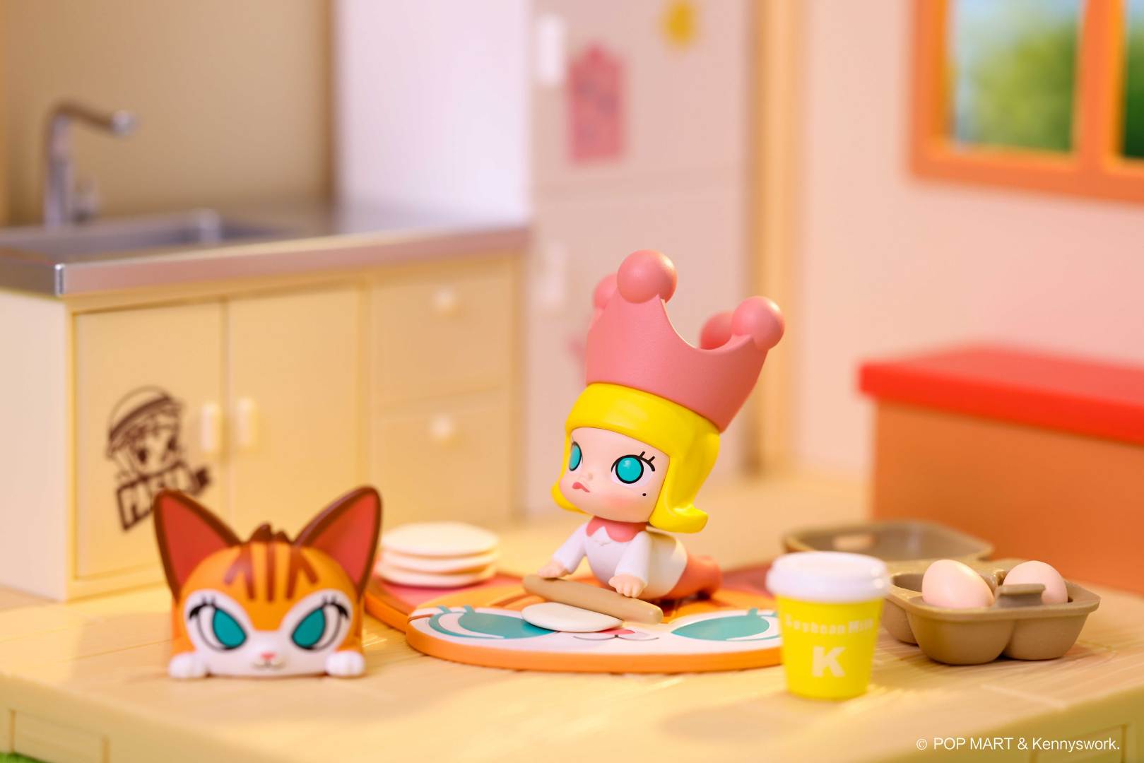 Mini Me Molly Cooking Prop Blind Box Series toy figurine with a crown, cup, and eggs on table.