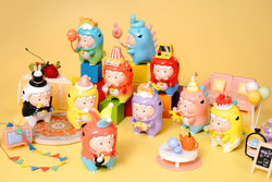 A group of small toy figurines from the DoDoLo Party Time Blind Box Series.