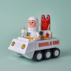 Toy vehicle with two characters, Nebula One Rover from Joy Riders by Chris Lee & Matt Kaufenberg, on a space adventure mission.