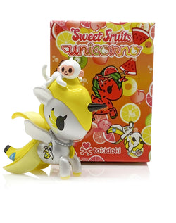 Toy figurine of a banana with a monkey on top, part of Sweet Fruits UNICORNO Blind Box Series.