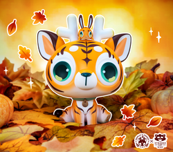 DeerCat & Friends - Tiger Edition toy with bird on head, in leaves.