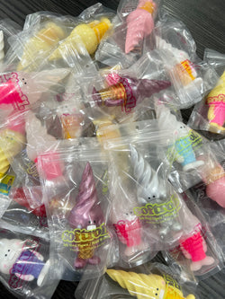 Japanese Sofubi toy product image featuring SOFTROLLS by Hariken in plastic bags with unicorn toys and other figurines.