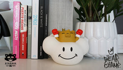 Vinyl art toy lamp featuring a toy bear in a cloud, a white planter with a boxing glove, a yellow stuffed animal, and more.