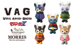 VAG 26 - Morris: A group of cartoon characters and a toy animal wearing a coat, close-up of a toy animal with yellow eyes.