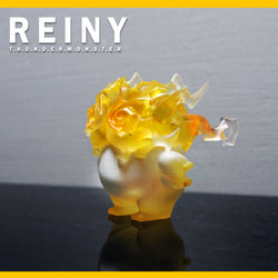 A unique resin sculpture of REINY, a confident and adventurous yellow animal figurine, 70mm in size.