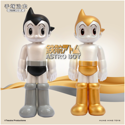 TZKV-019PA ATOM - Standing Gold & Silver toy figurines close up, vinyl/PVC, 135mm height.